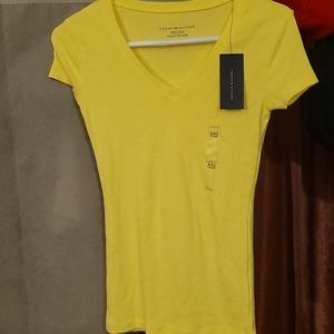 Shirt yellow short sleeves with v neck.
